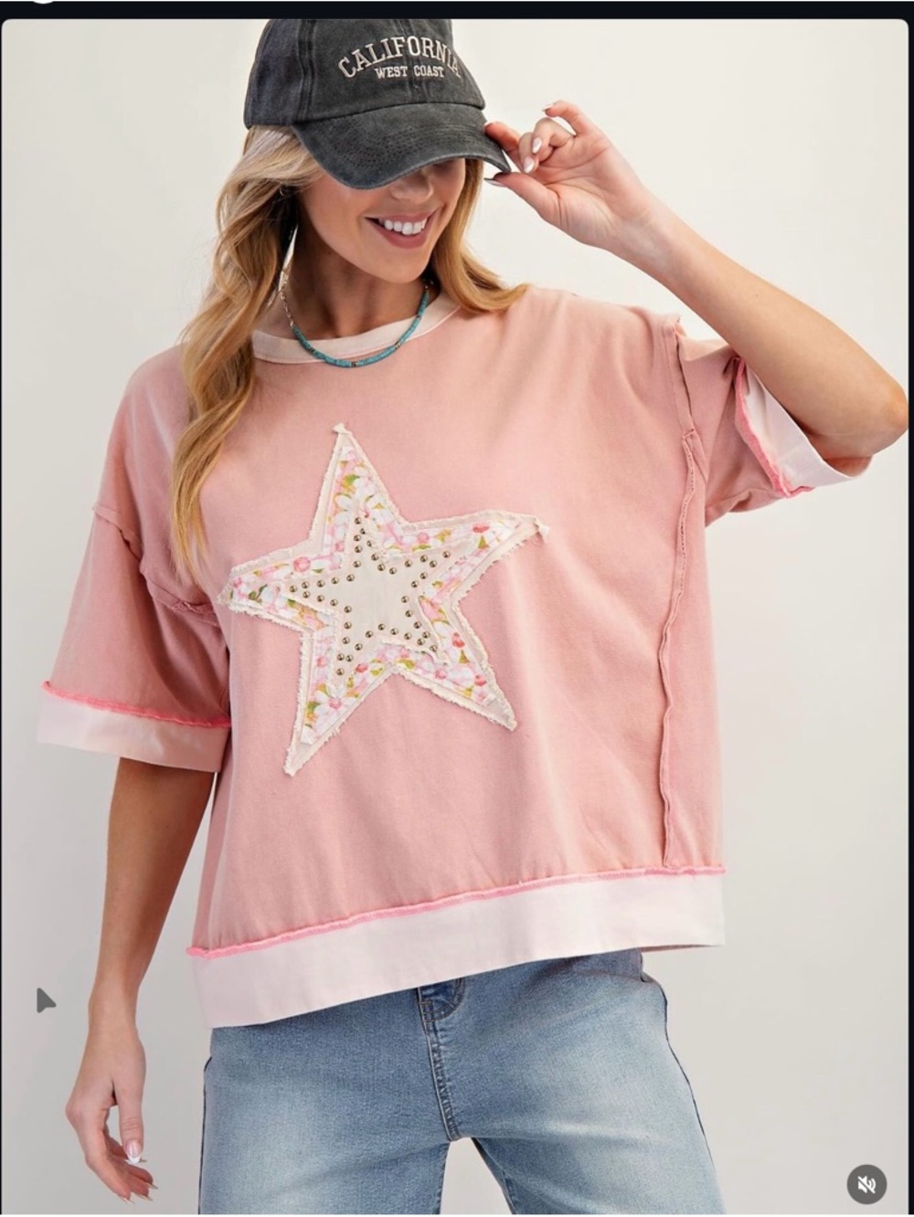 Easel mineral-washed cotton top, and a prominent floral star patch.